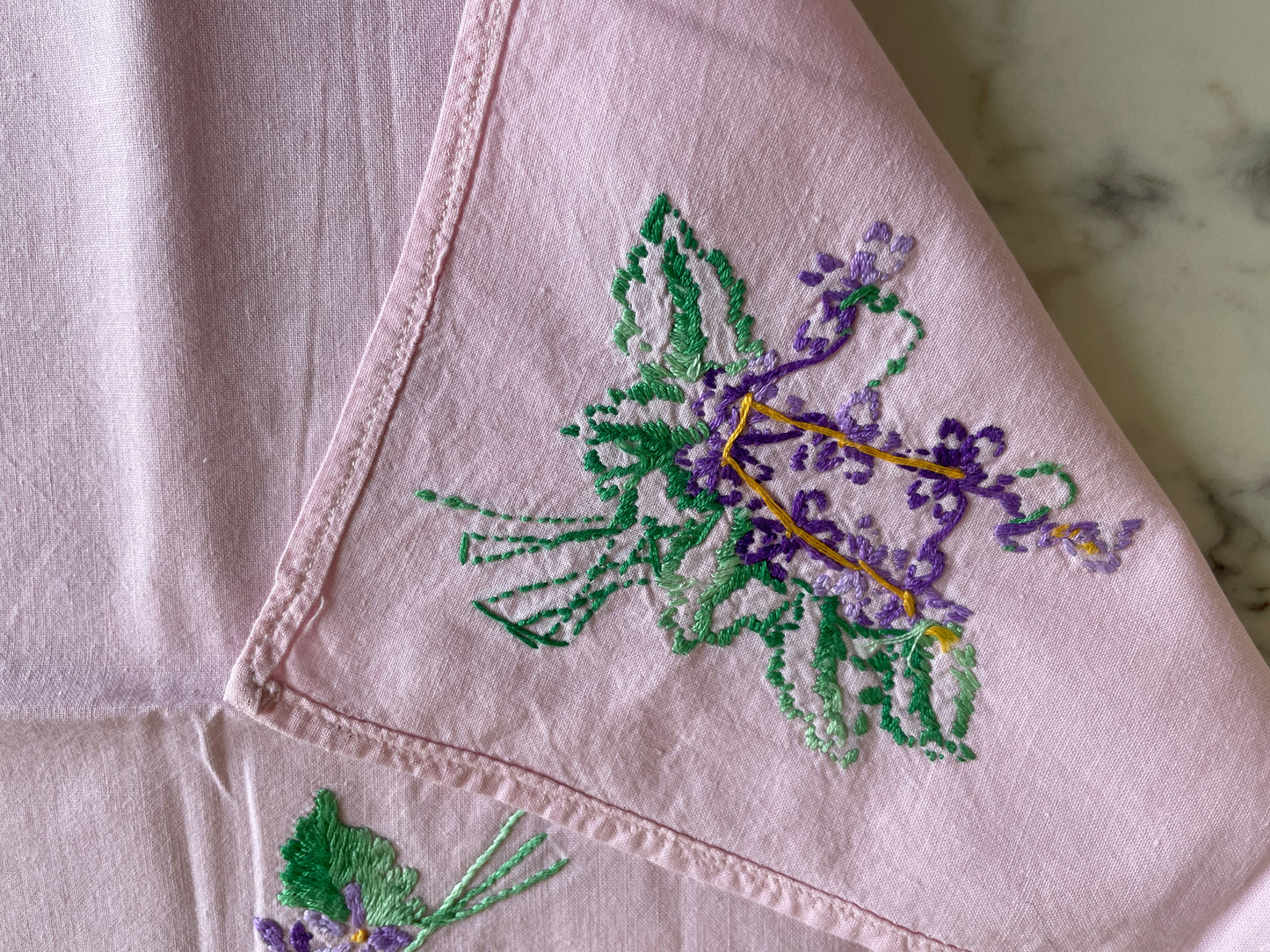 Small square tablecloth in light cotton embroidered with violet flowers