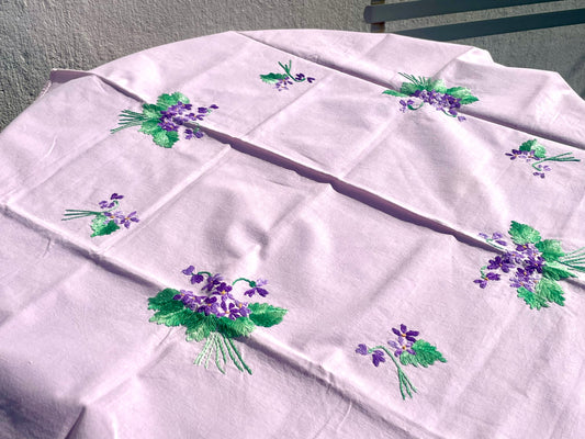 Small square tablecloth in light cotton embroidered with violet flowers