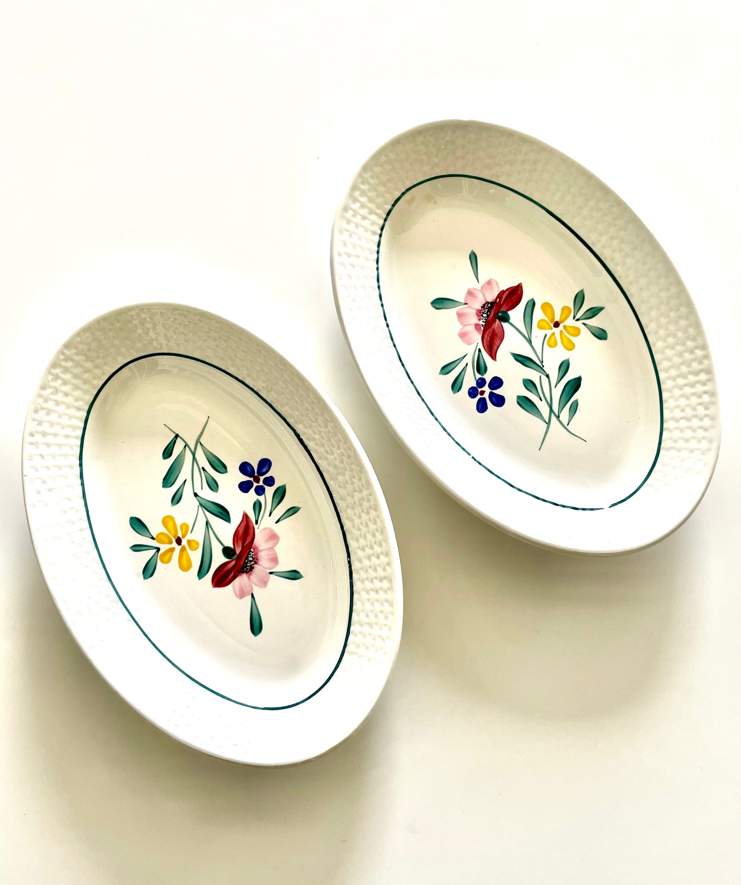 Two "Fabiola" iron earth dishes
