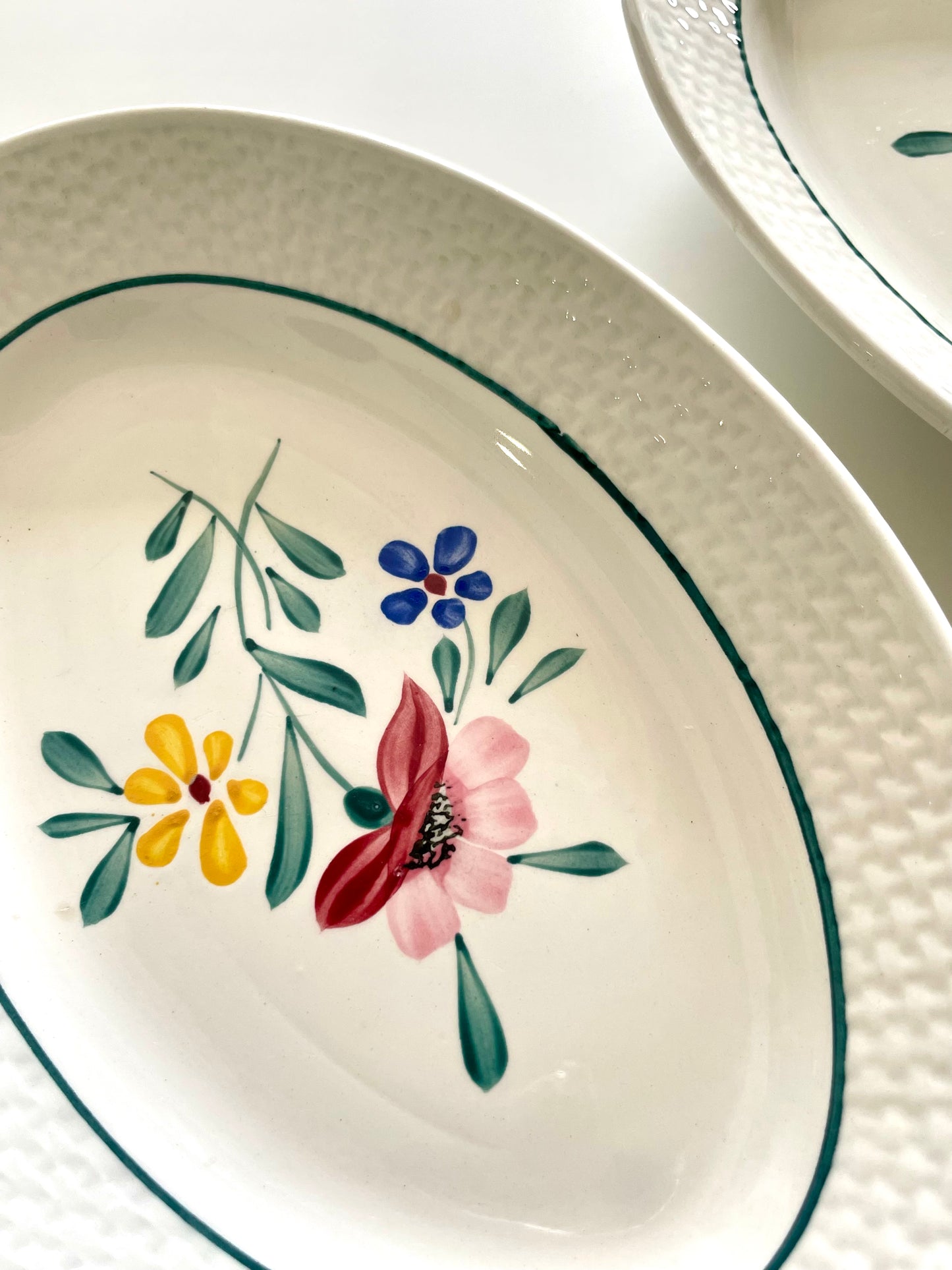 Two "Fabiola" iron earth dishes