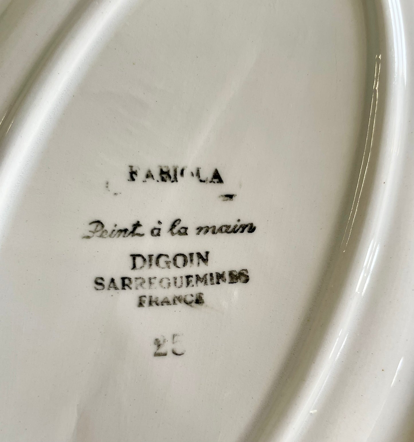Two "Fabiola" iron earth dishes