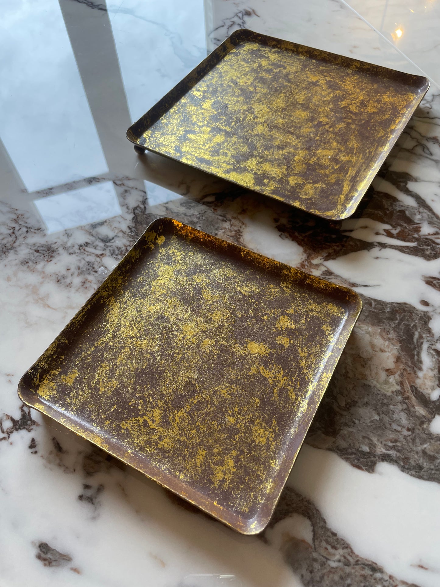 Set of two gilded brass trays