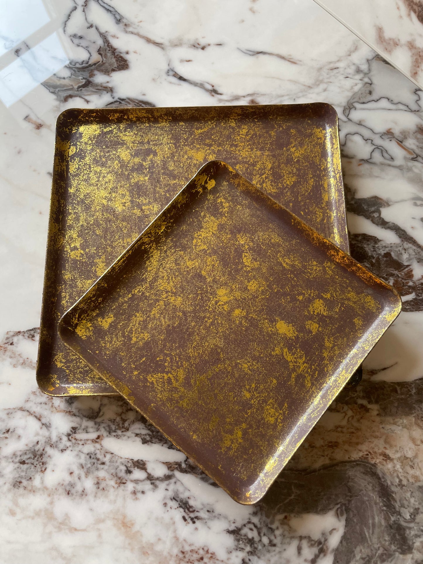 Set of two gilded brass trays