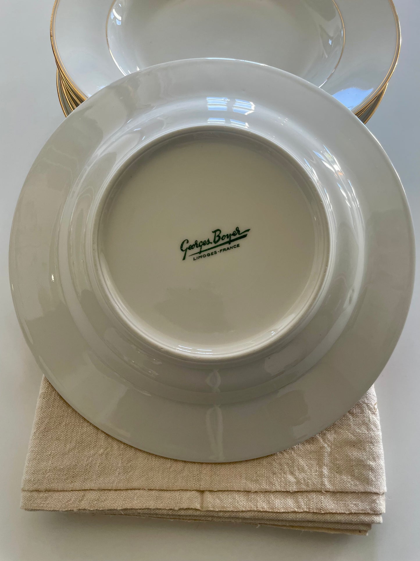 Georges Boyer white Limoges porcelain dinner service with gold edging