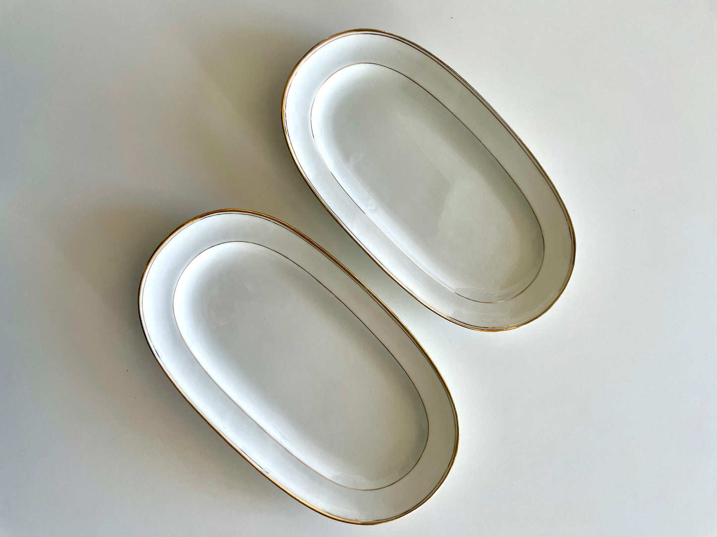 Georges Boyer white Limoges porcelain dinner service with gold edging