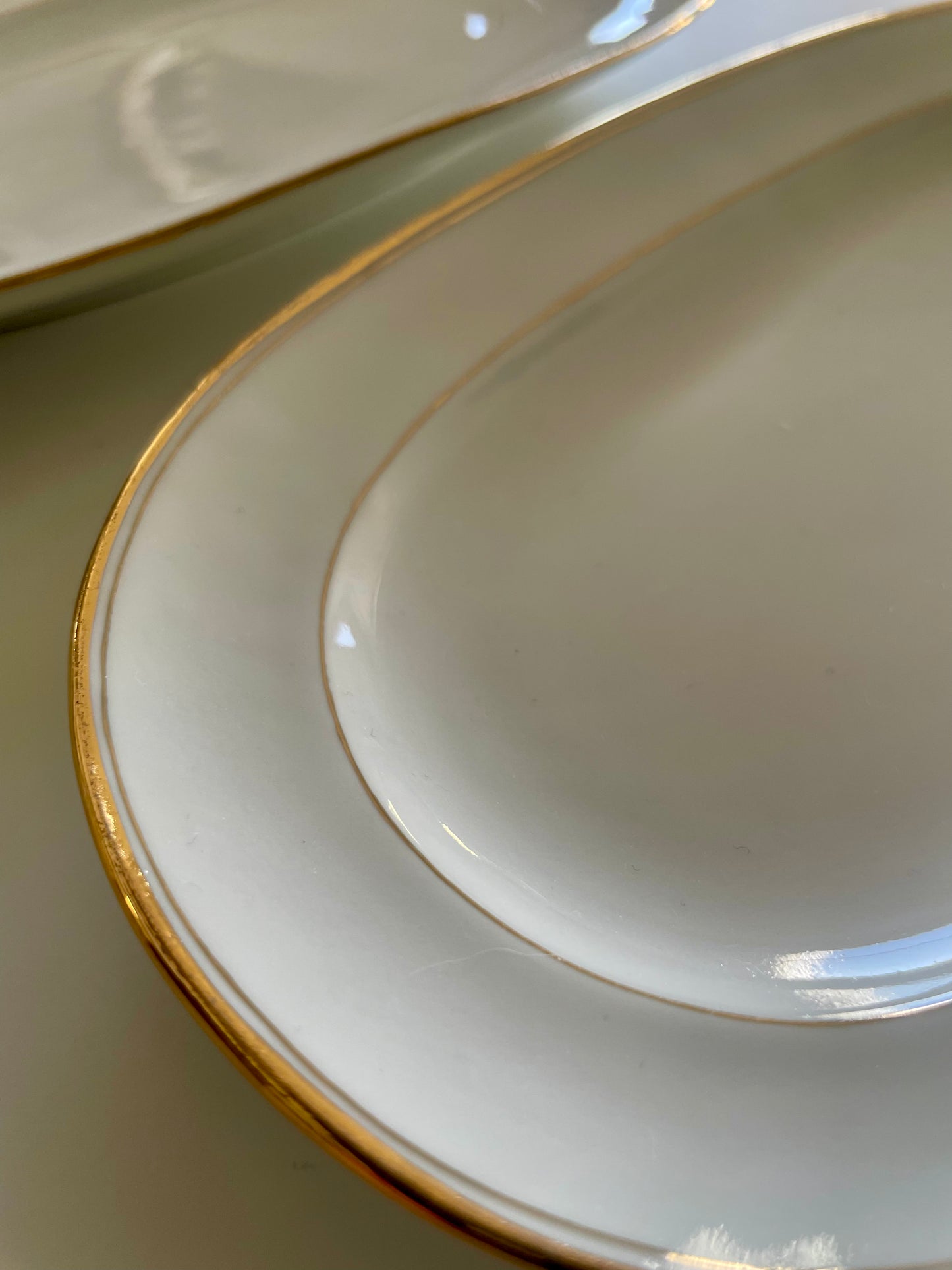 Georges Boyer white Limoges porcelain dinner service with gold edging