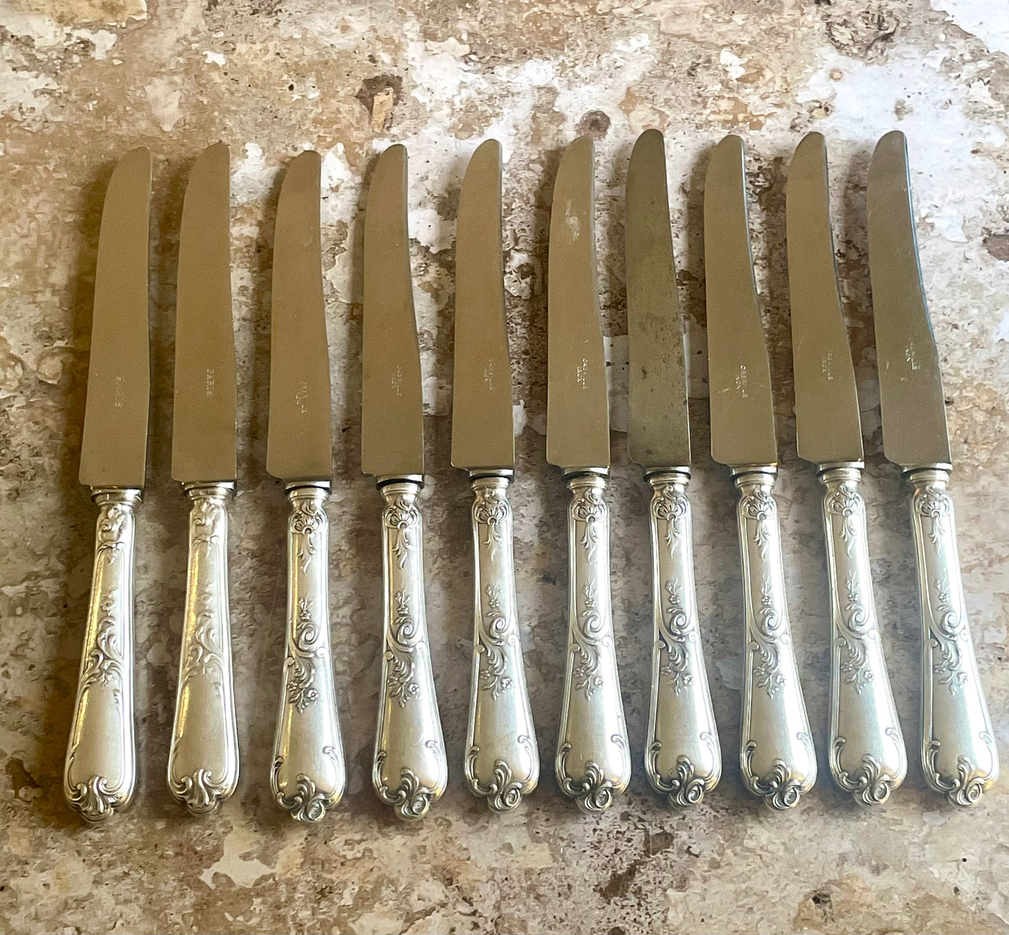 10 silver metal knives