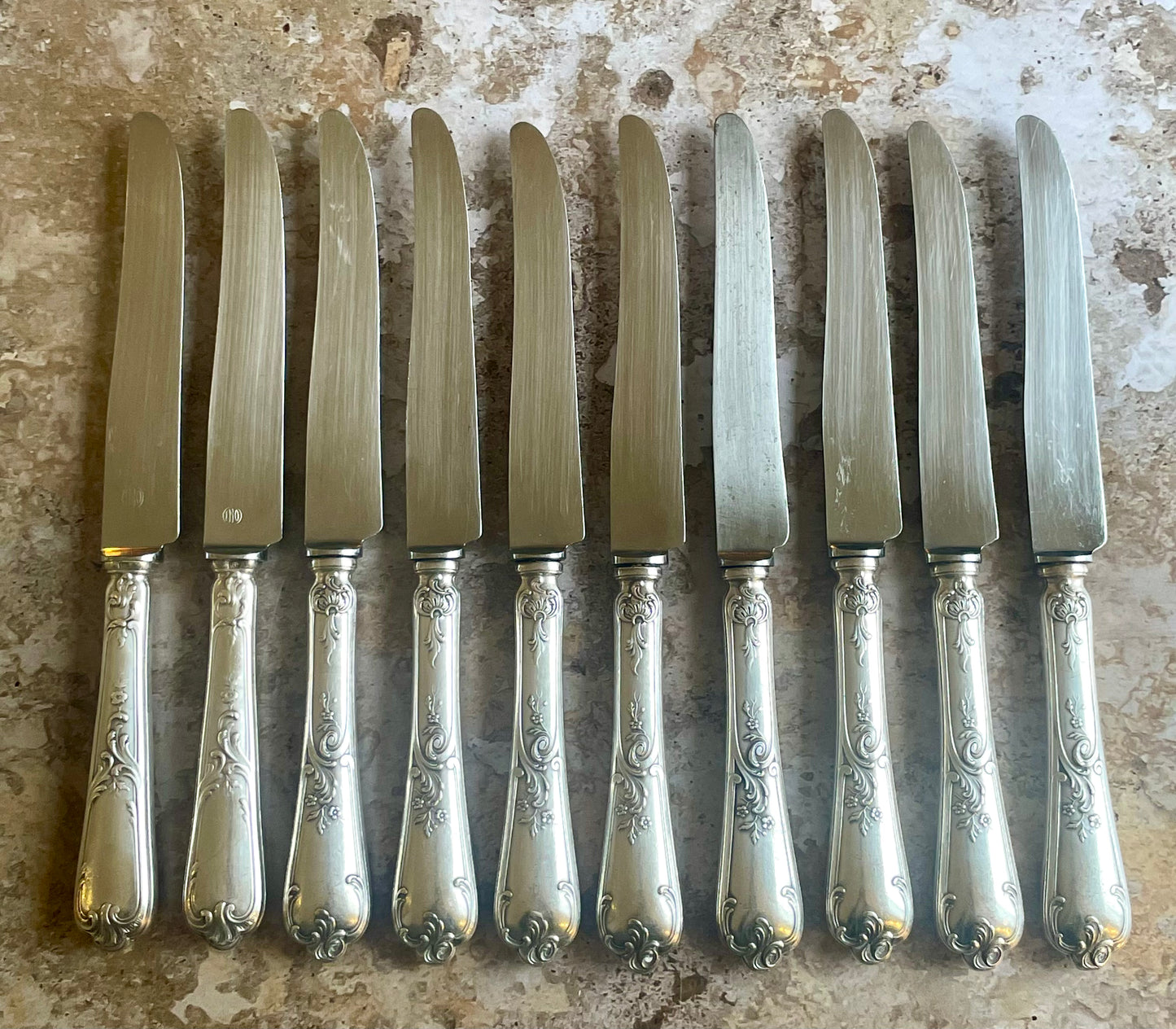 10 silver metal knives