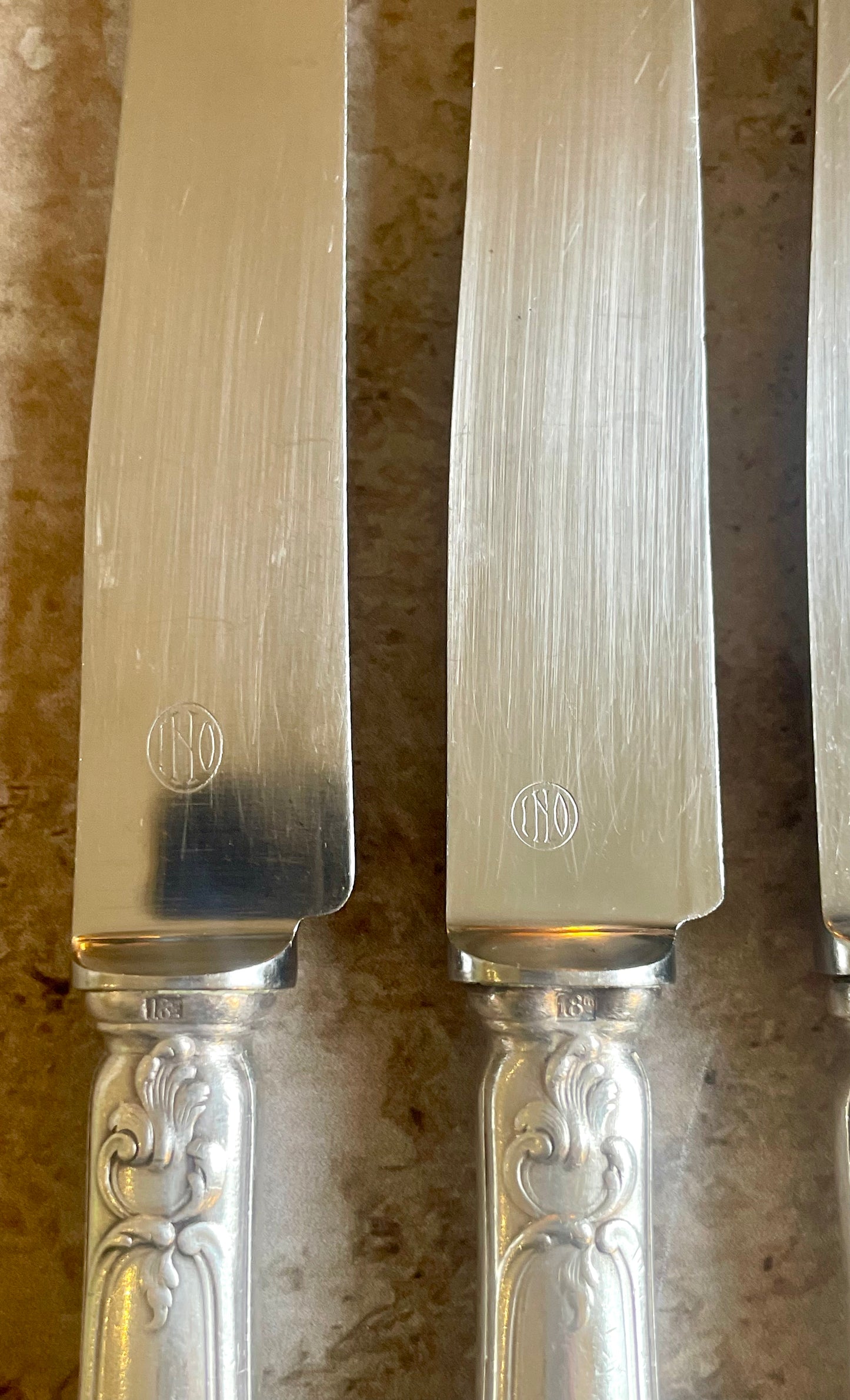 10 silver metal knives