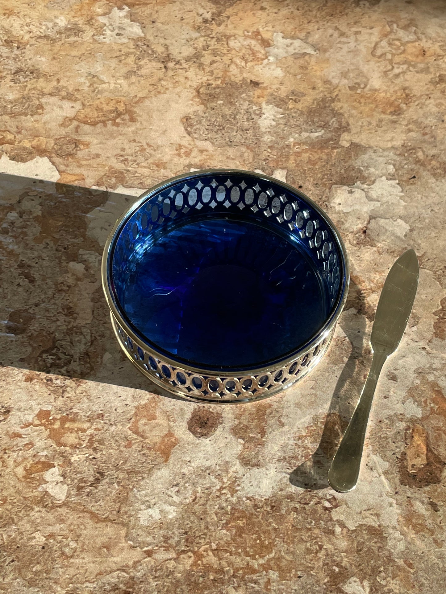 Butter dish with its silver metal knife